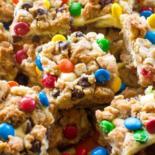 Monster Cookie Cheesecake Bars - The Girl Who Ate Everything
